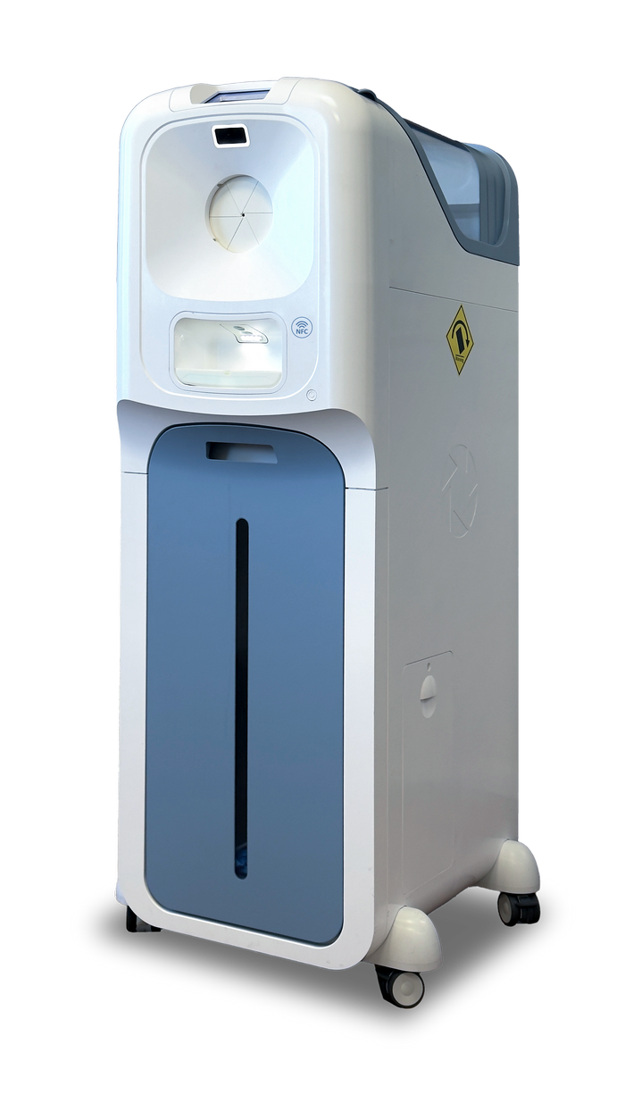 A clinician beside the IGIN® automated, touch-free glove dispenser